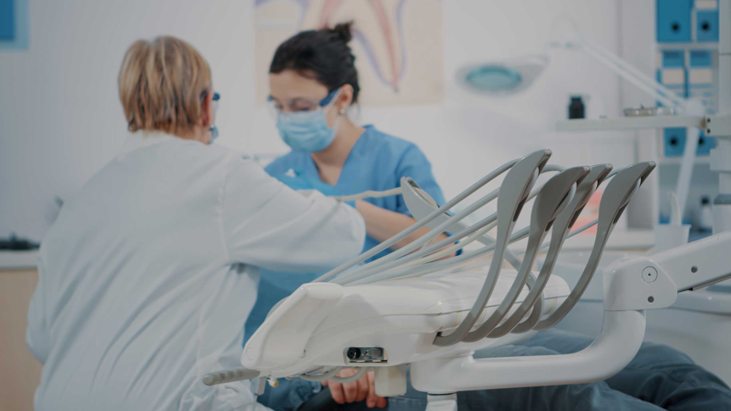 Dental team caring for a patient in a modern clinic