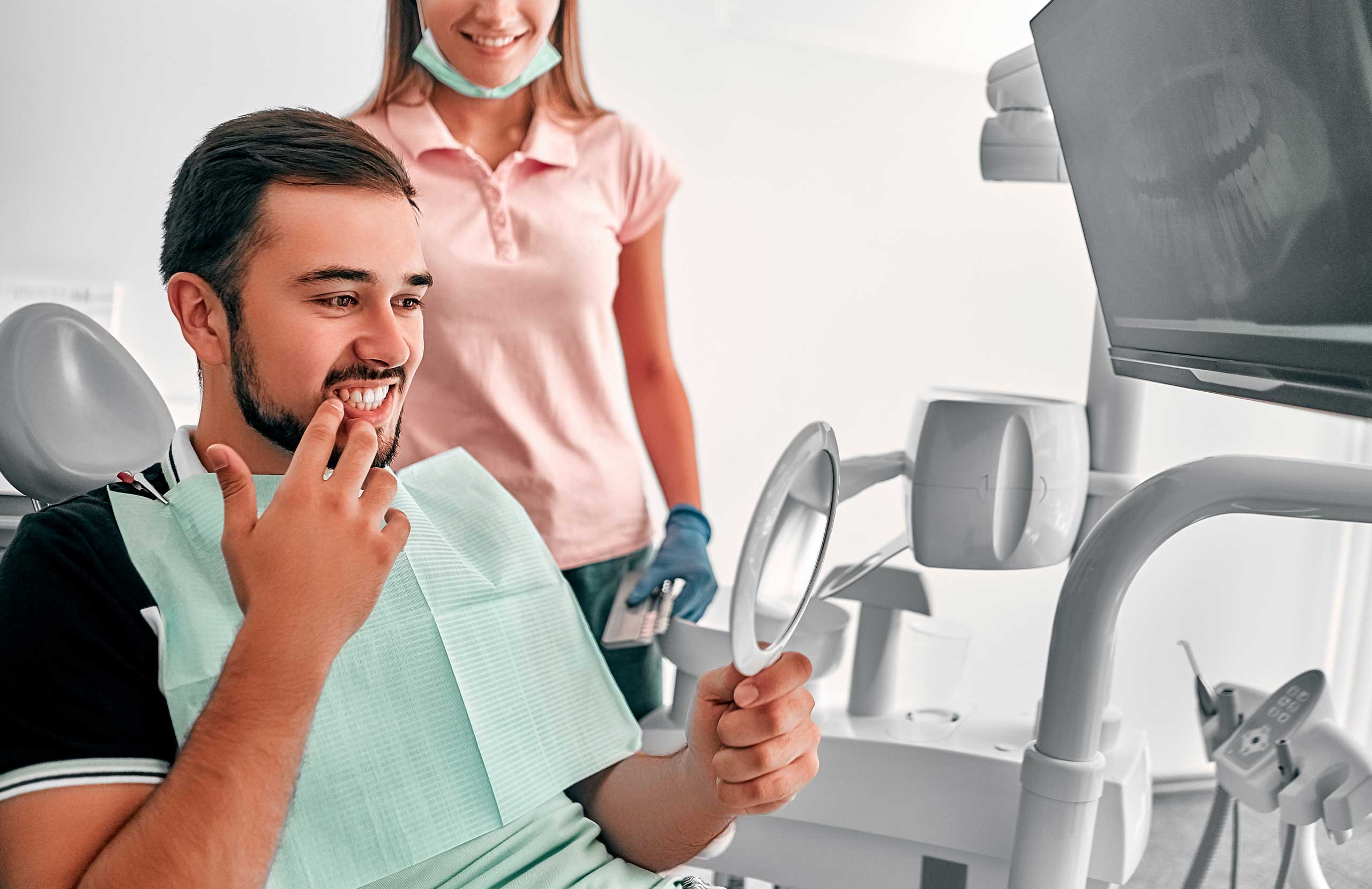 Dental clinician examining a patient’s tooth